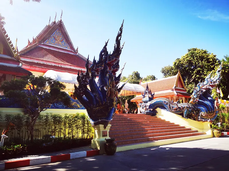 Wat Phra Narai Maharat entrance and naga sculptures, photographed in 2021.